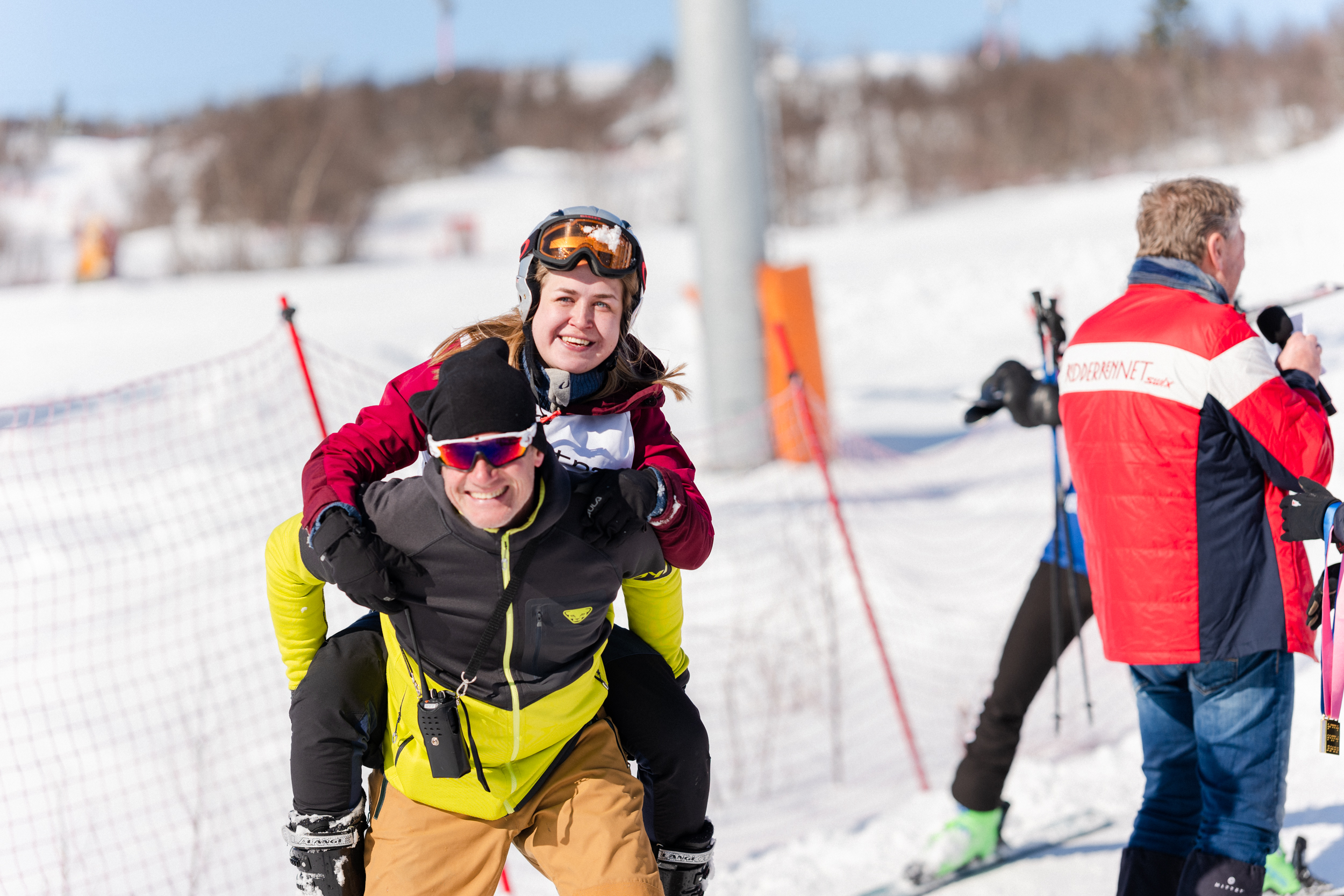 Downhill participant catching a ride down the course